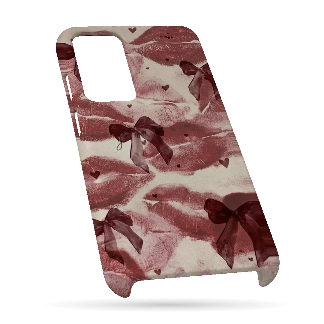 Kiss Marks and Bows 3D Print OnePlus 9R Phone Case, bottom view; red lip-print graphics and ribbon bows on a pale pink background