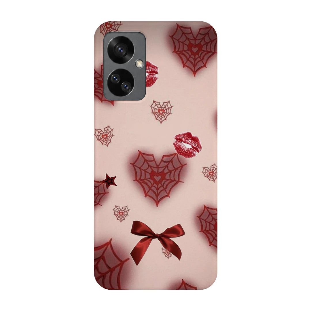 Pink Webs and Bows 3D Print OnePlus Nord 2T Phone Case, back view; red spiderweb hearts, lips and ribbon bows on a pale pink background