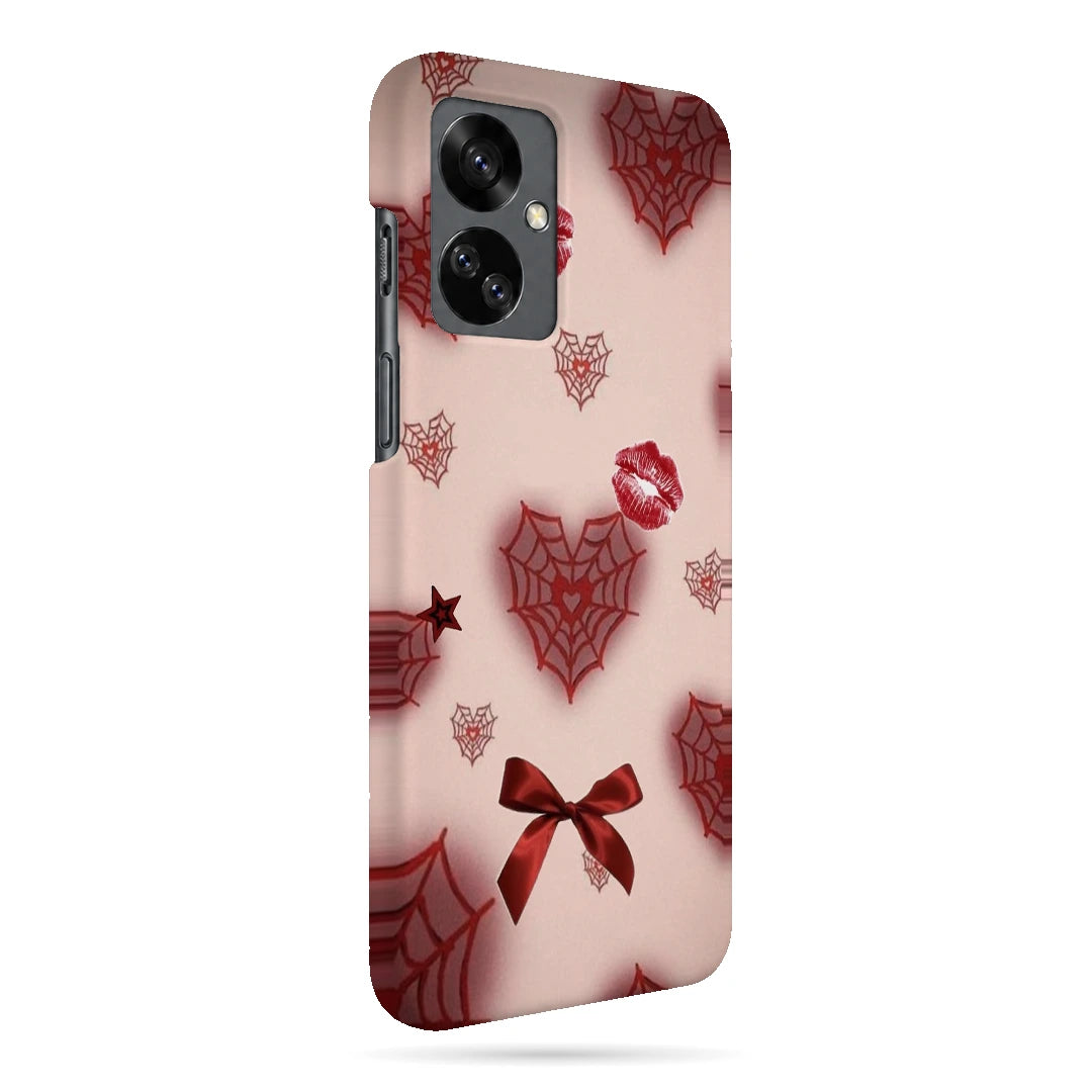 Pink Webs and Bows 3D Print OnePlus Nord 2T Phone Case, right-side view; red spiderweb hearts, lips and ribbon bows on a pale pink background