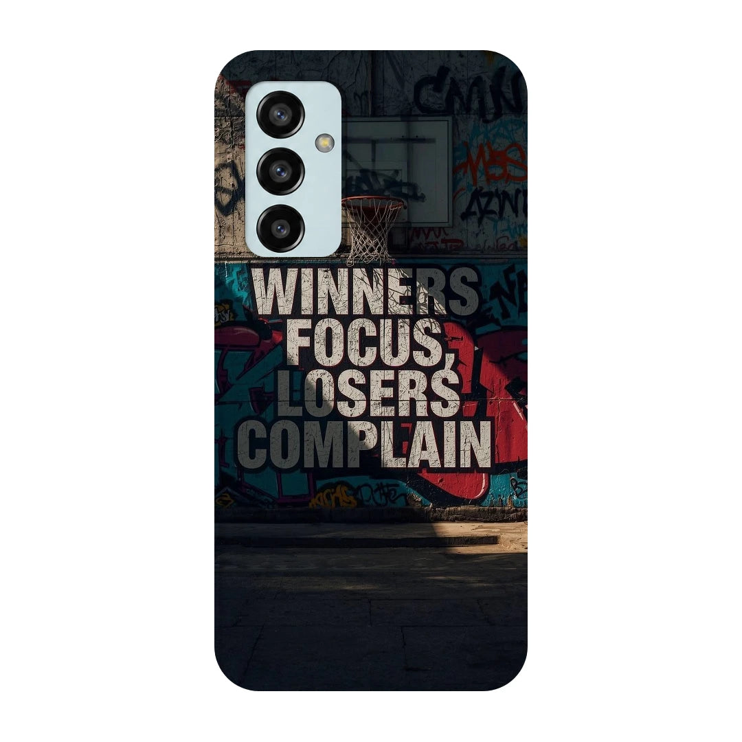 Winners Focus Quote 3D Print Samsung F13 Phone Case, back view; bold Winners Focus Losers Complain lettering over dark graffiti-style artwork