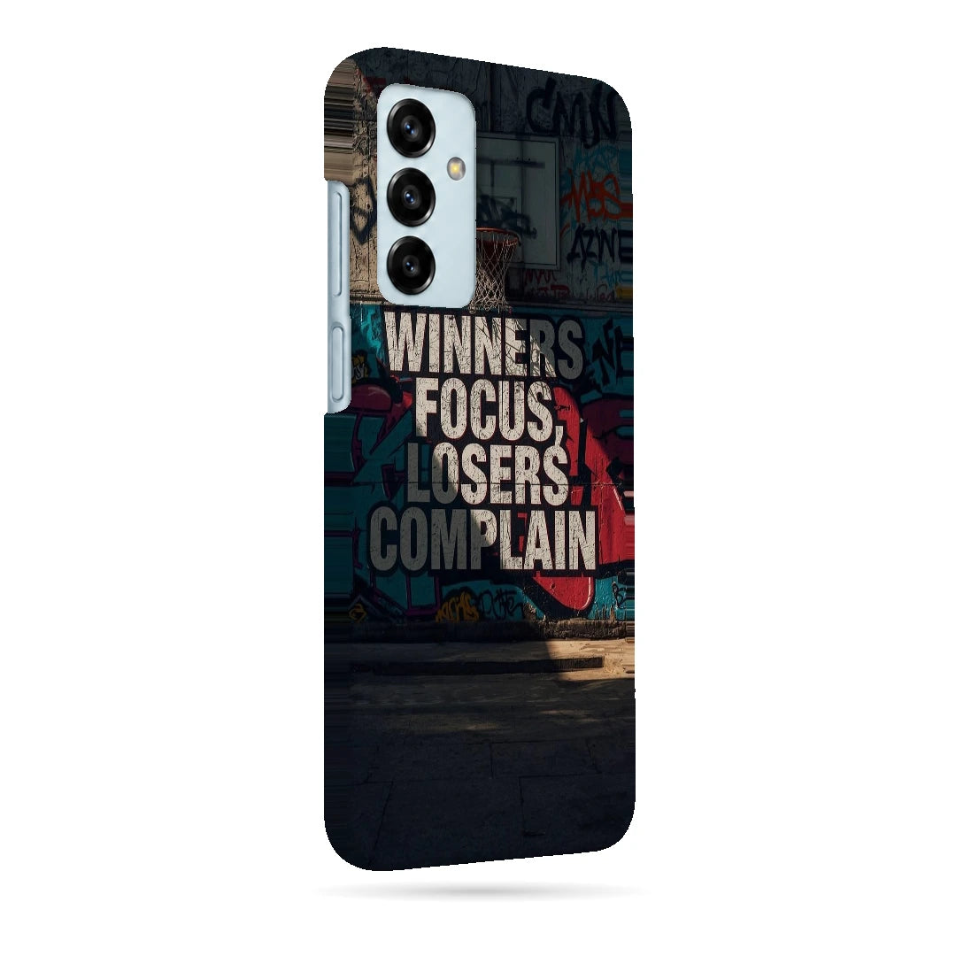 Winners Focus Quote 3D Print Samsung F13 Phone Case, right-side view; bold Winners Focus Losers Complain lettering over dark graffiti-style artwork